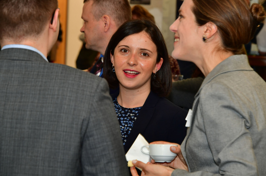 A photograph of participants in the SRS course 19-04 attending a reception.