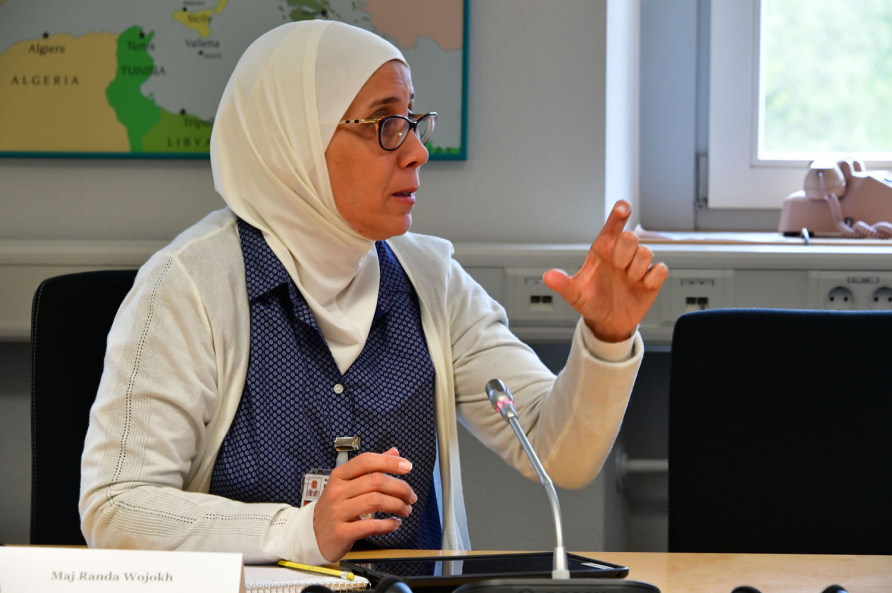 A photograph of participants in the SRS course attending a reception.