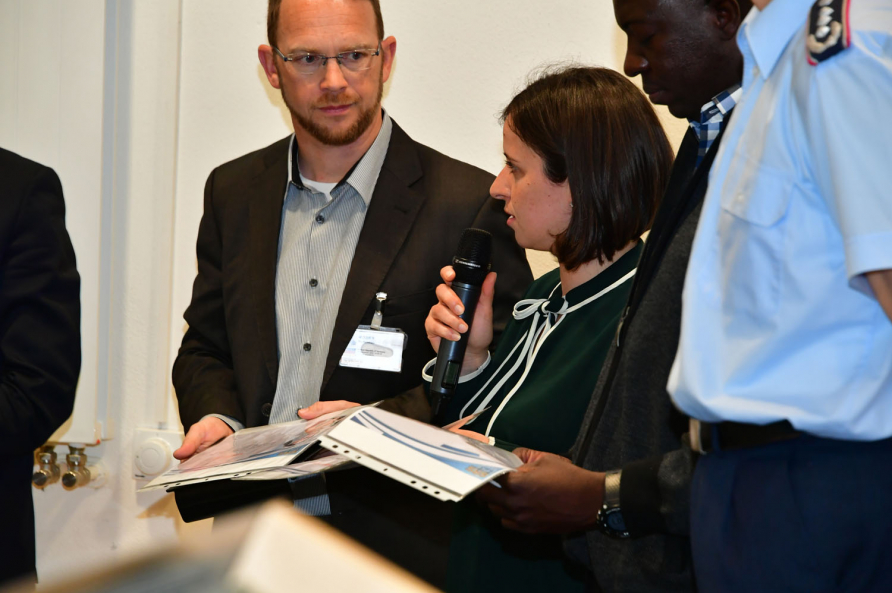 A photograph of participants in the SRS course 19-04 attending a reception.